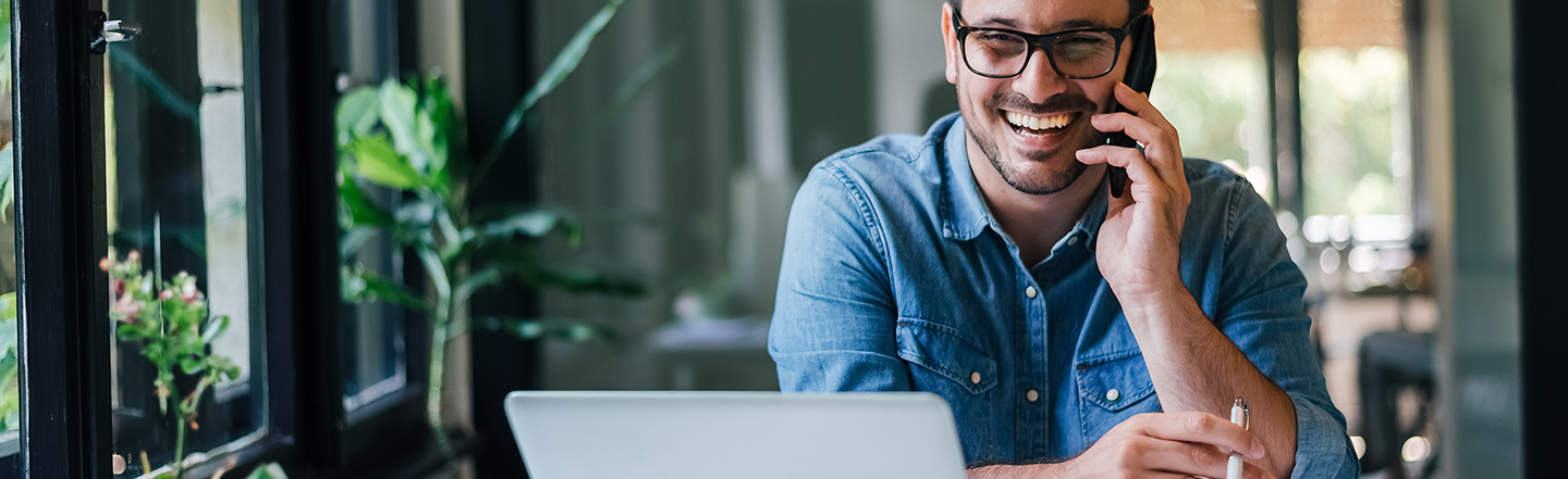 HR professional on the phone talking about employee engagement and total compensation statements