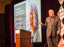 Mark Bertolini of Aetna speaking at bswift's Idea Exchange conference in 2018