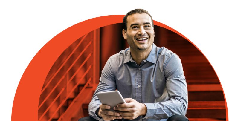 Man smiling with mobile device