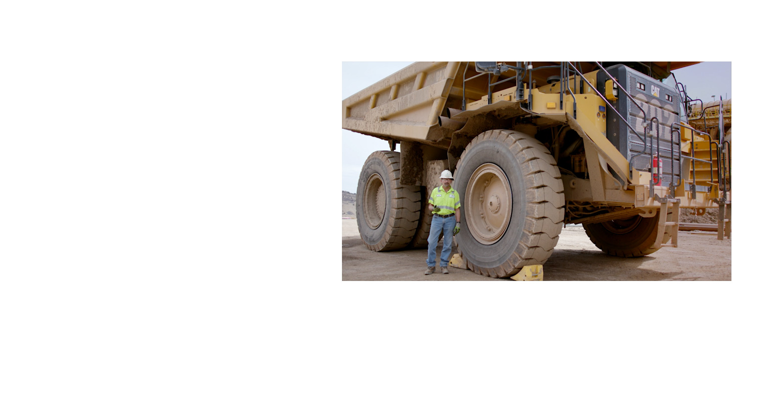 video still of LafargeHolcim worker standing in front of industrial equipment