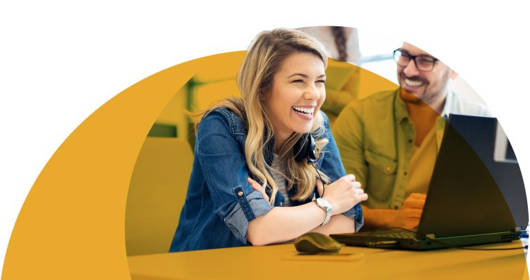 Laughing woman engaging with coworkers