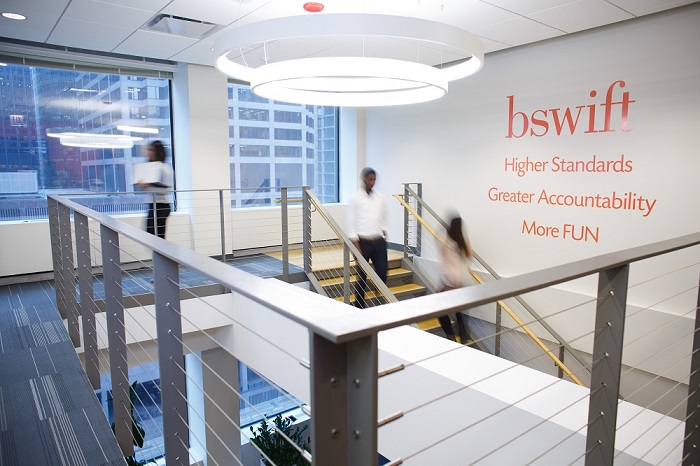 The bswift office with their values of Higher Standards, Greater Accountability and More Fun written on the wall