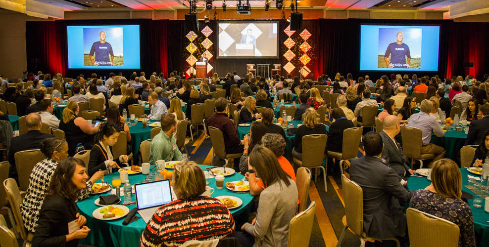Large group of attendees in ballroom