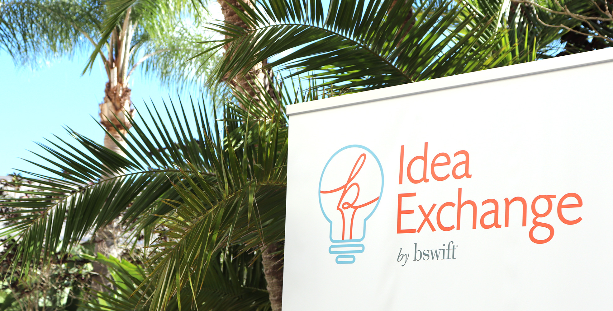 Idea Exchange 2019 Sign and Palm Trees