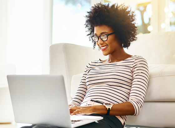 Woman typing on a laptop