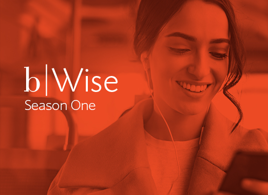 Woman smiling listening to a podcast