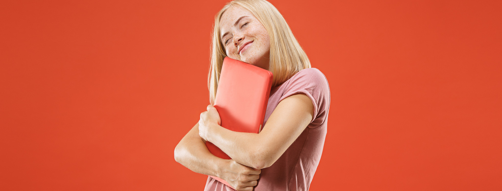 Woman hugging laptop