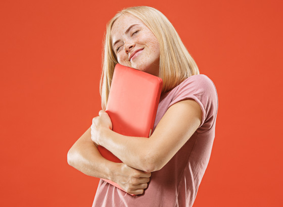 Woman hugging laptop