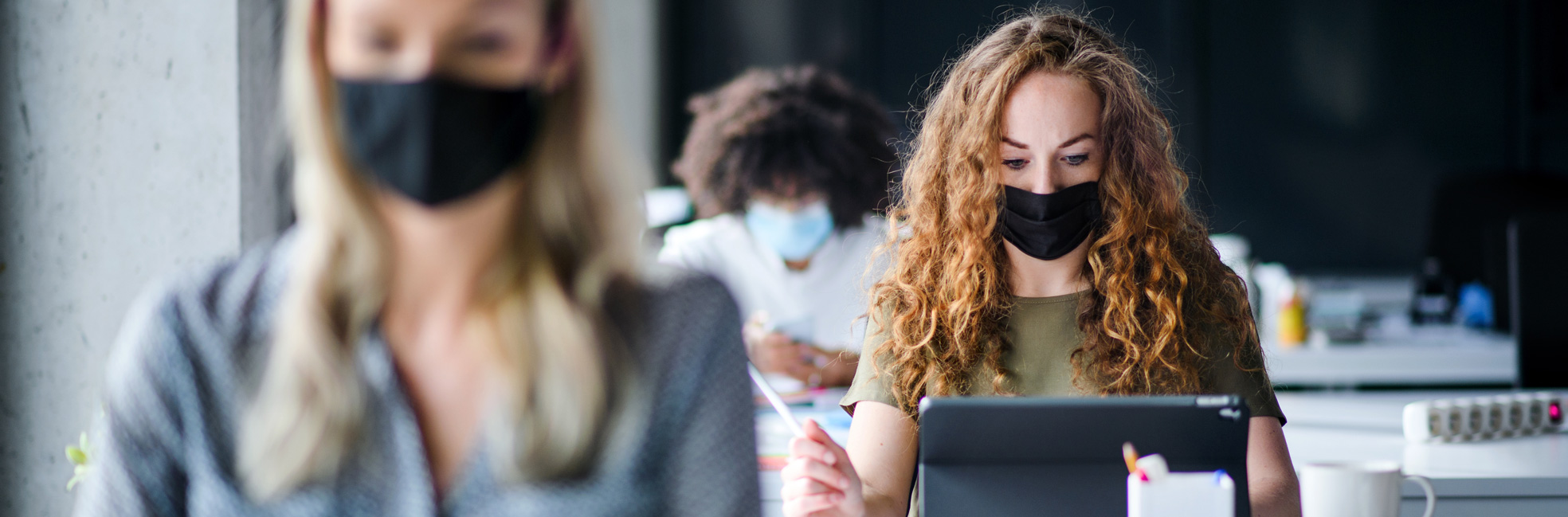 Masked employees at work