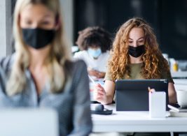 Masked employees at work