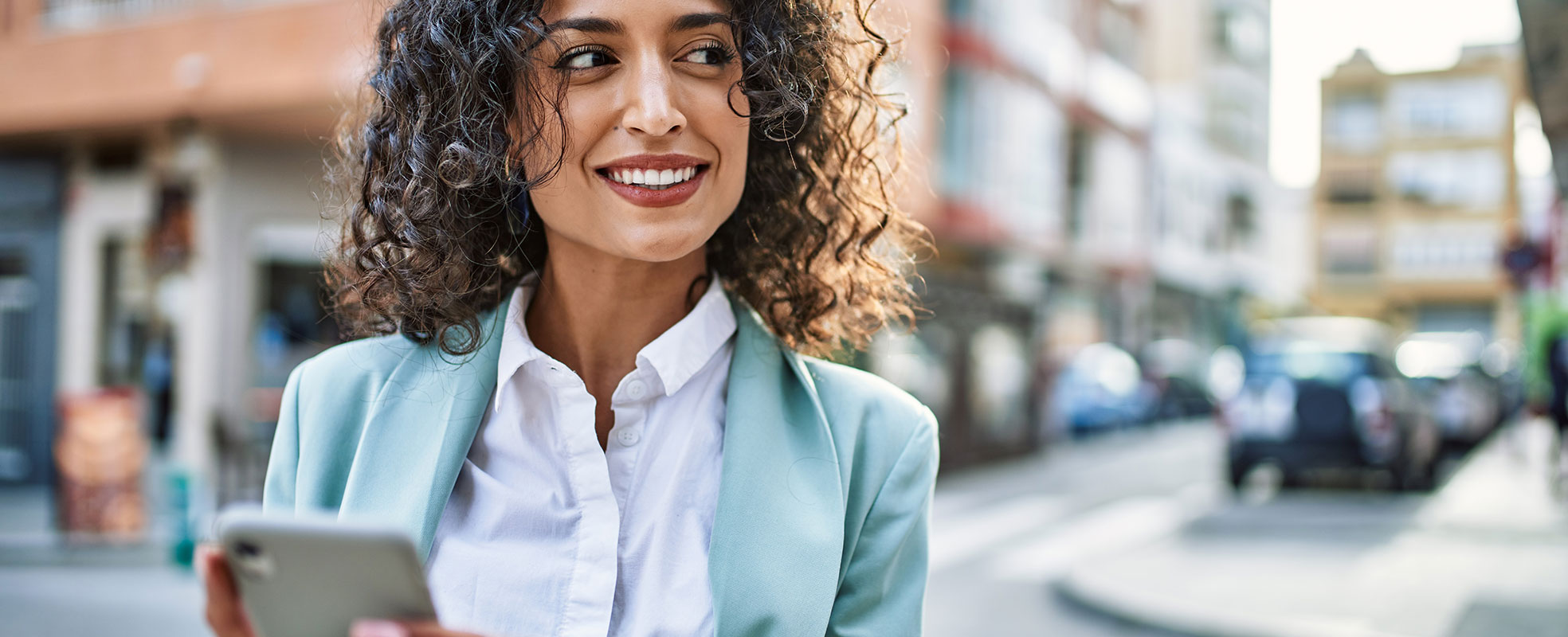 Woman managing benefits enrollment on her phone