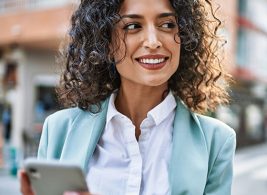 Woman managing benefits enrollment on her phone