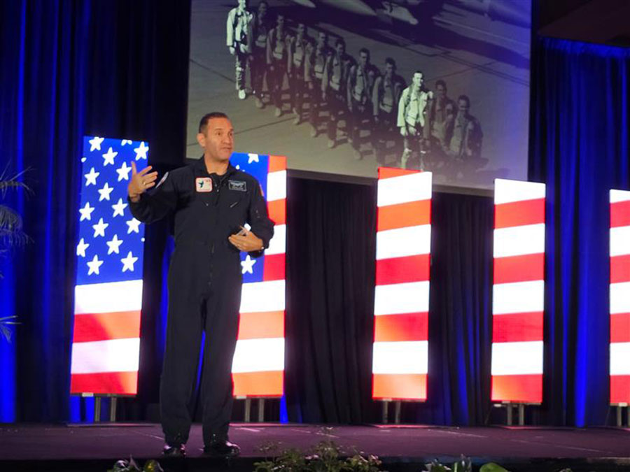 Lt. Col. Waldo Waldman speaking at Idea Exchange 2025 to a crowd of HR leaders